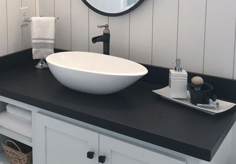modern bathroom sink with a laminate countertop