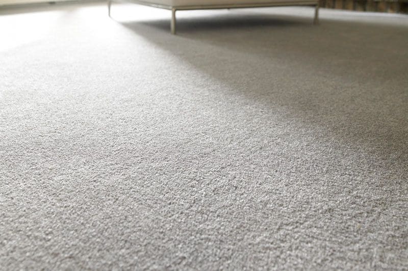 Up close view of a light colored carpet