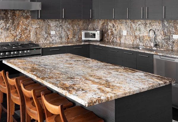 Kitchen with white and copper granite countertops