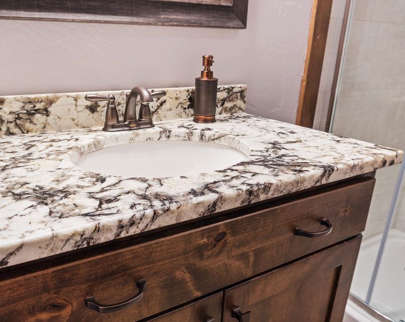 Marble countertop on a rustic bathroom vanity