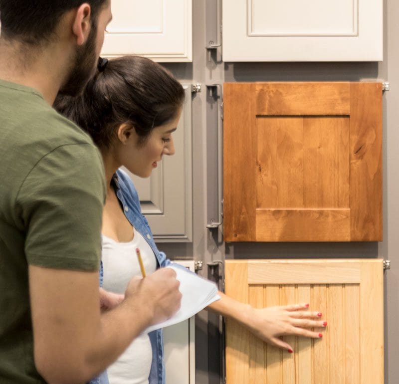 women selecting new cabinet material for a Kitchen or Bathroom remodel